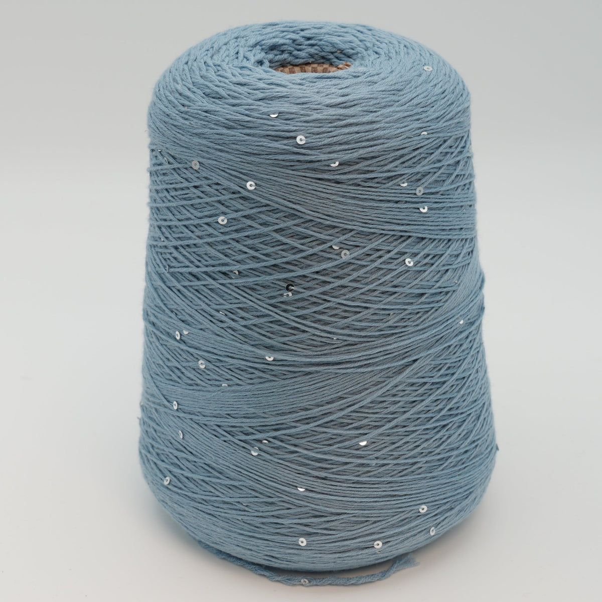 Cone of Antilope 2/60 merino and sequin blend yarn in Stormy Sky.