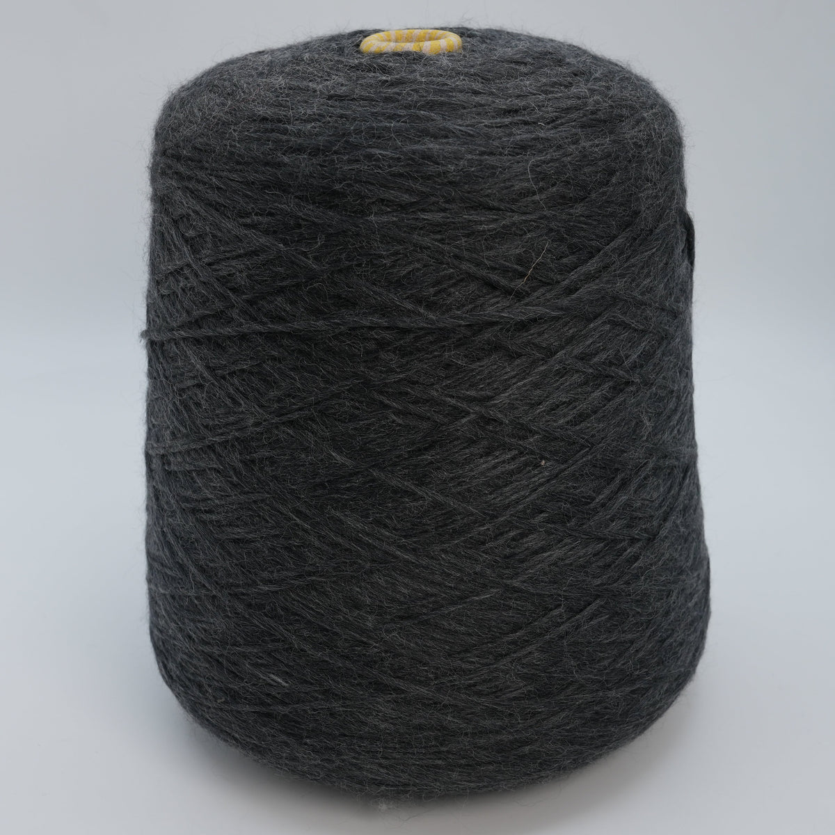 Cone of Artico 1800 fluffy roving yarn, a merino and acrylic blend by Miroglio Group.