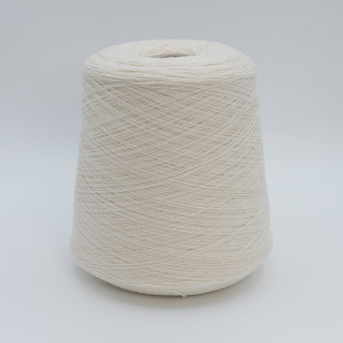 Cone of Canberra 1/15 100% lambswool merino yarn in Milk Cloud.