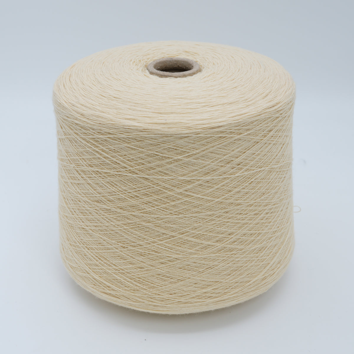 Cone of Canberra 1/15 100% lambswool merino yarn in pale cream.