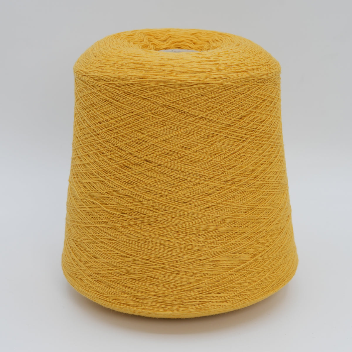 Cone of Canberra 1/15 100% lambswool merino yarn in Sunny Dandelion.