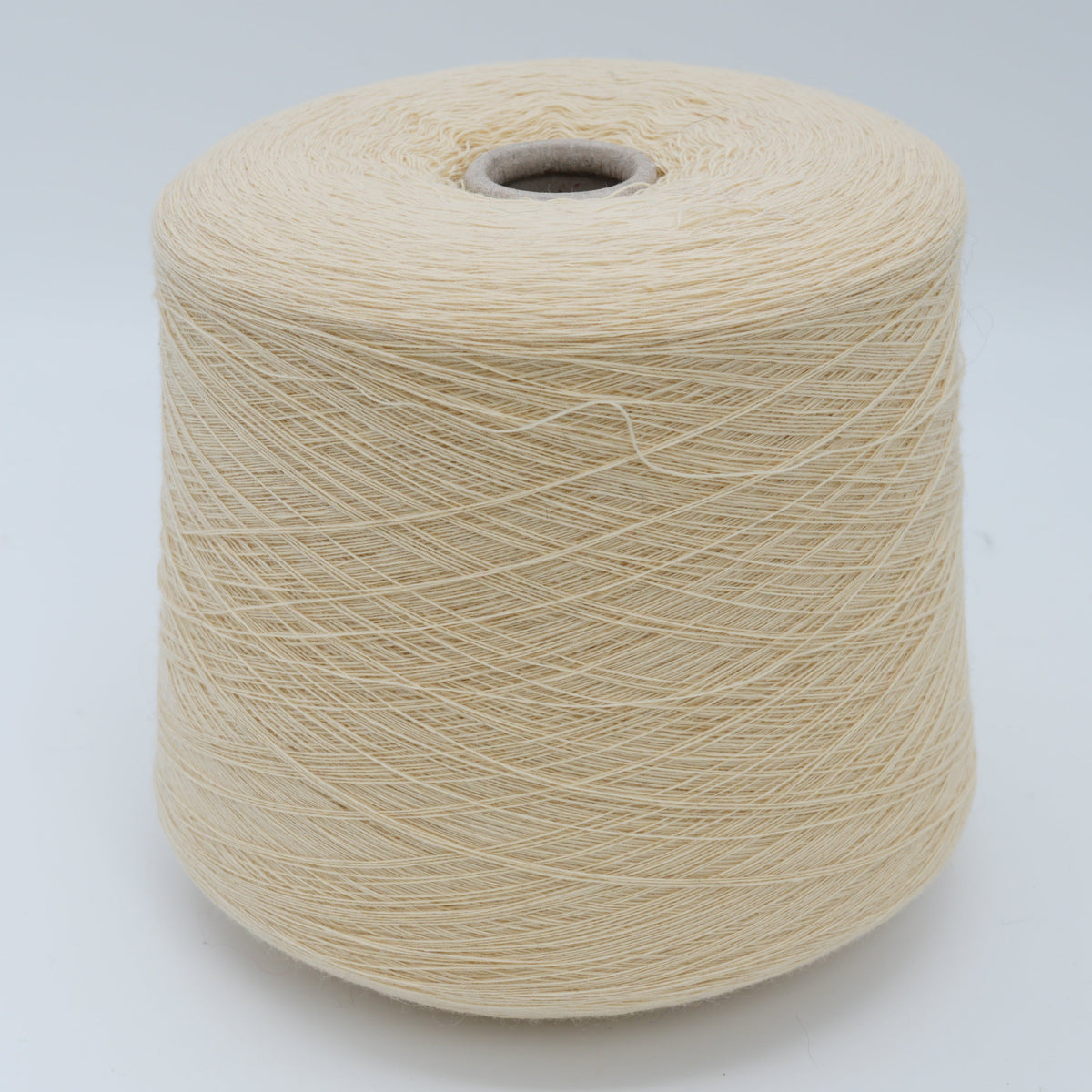 Cone of Canberra 1/15 100% lambswool merino yarn in Vanilla Husk.