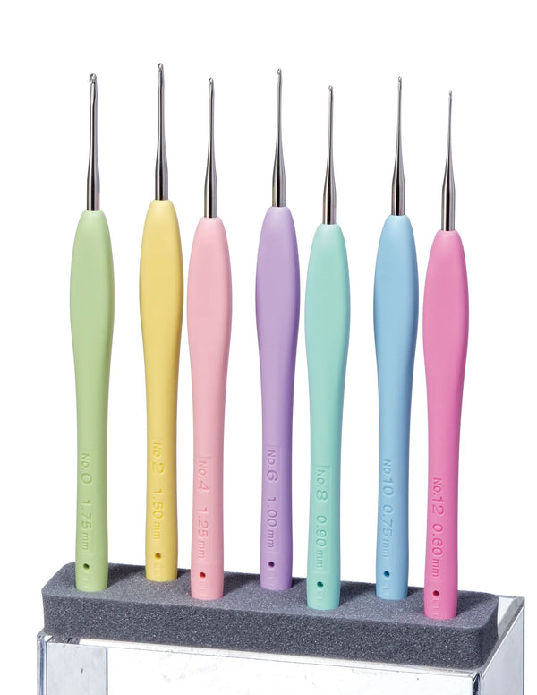 Seven Clover Amour Steel Crochet Hooks with pastel ergonomic handles displayed together for fine thread crochet