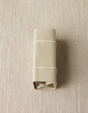 Cocoknits Accessory Roll in Gray rolled closed for compact storage and travel