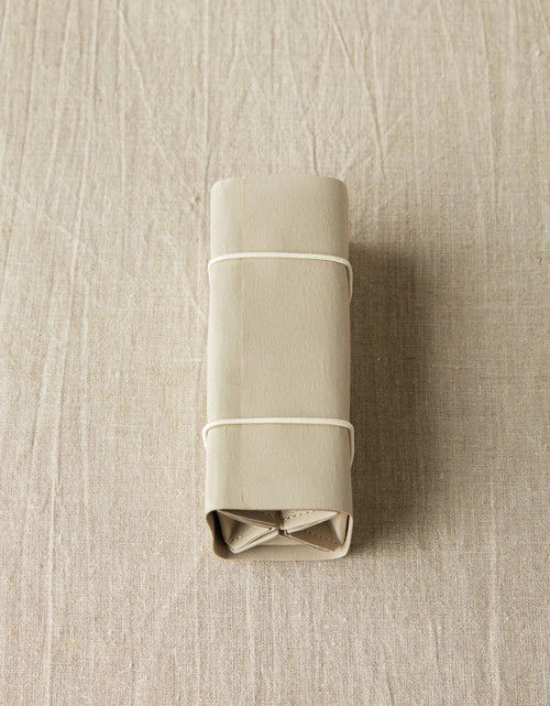 Cocoknits Accessory Roll in Gray rolled closed for compact storage and travel