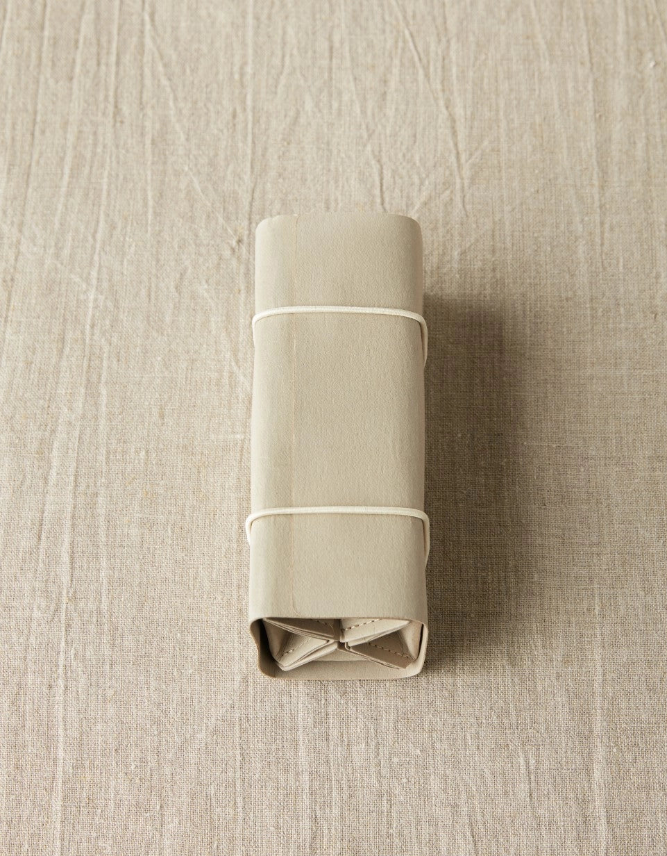 Cocoknits Accessory Roll in Gray rolled closed for compact storage and travel