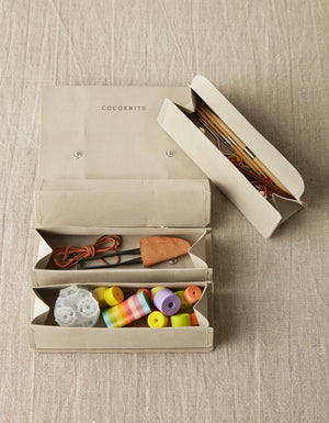 Cocoknits Accessory Roll in Gray with removable triangular storage pouches holding colorful knitting notions