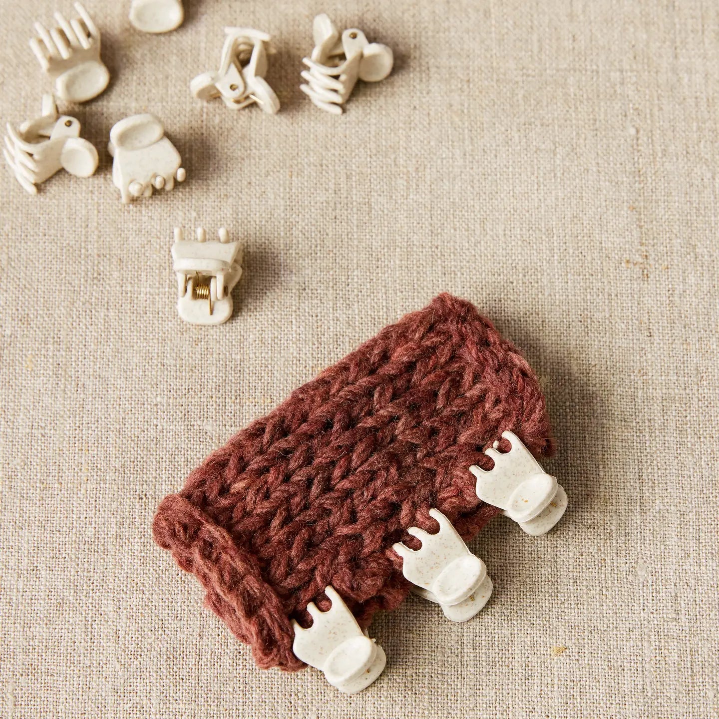 Cocoknits Claw Clips holding knitted pieces together for precise seaming and garment assembly