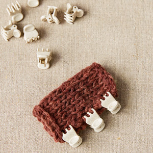 Cocoknits Claw Clips holding knitted pieces together for precise seaming and garment assembly