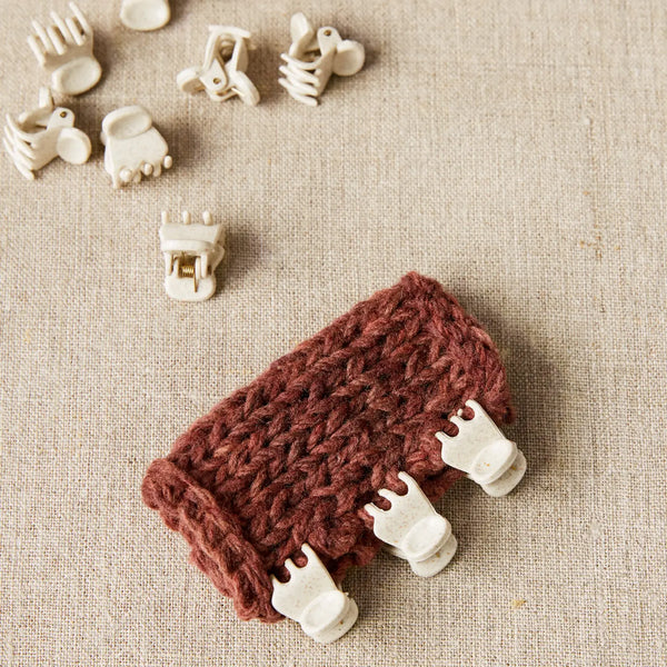 Cocoknits Claw Clips holding knitted pieces together for precise seaming and garment assembly