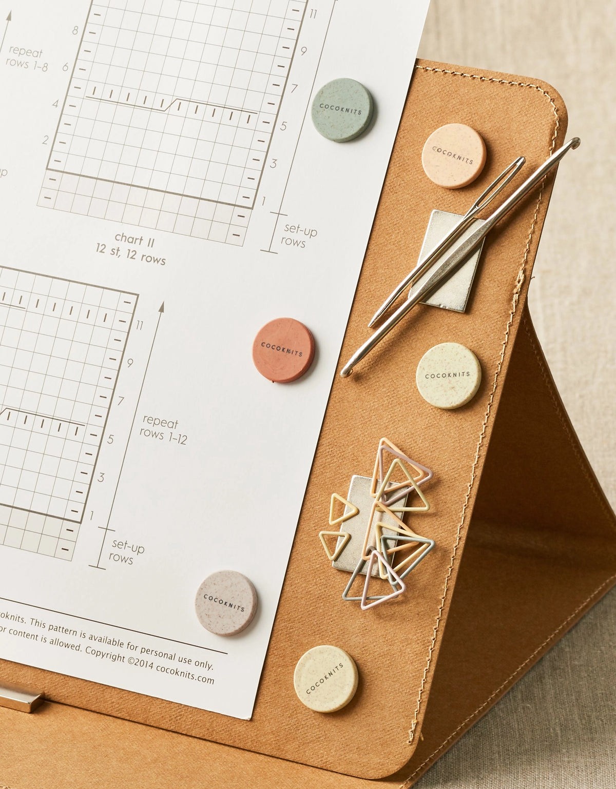 Cocoknits Colorful Magnets holding a knitting pattern and tools securely on the Maker's Board