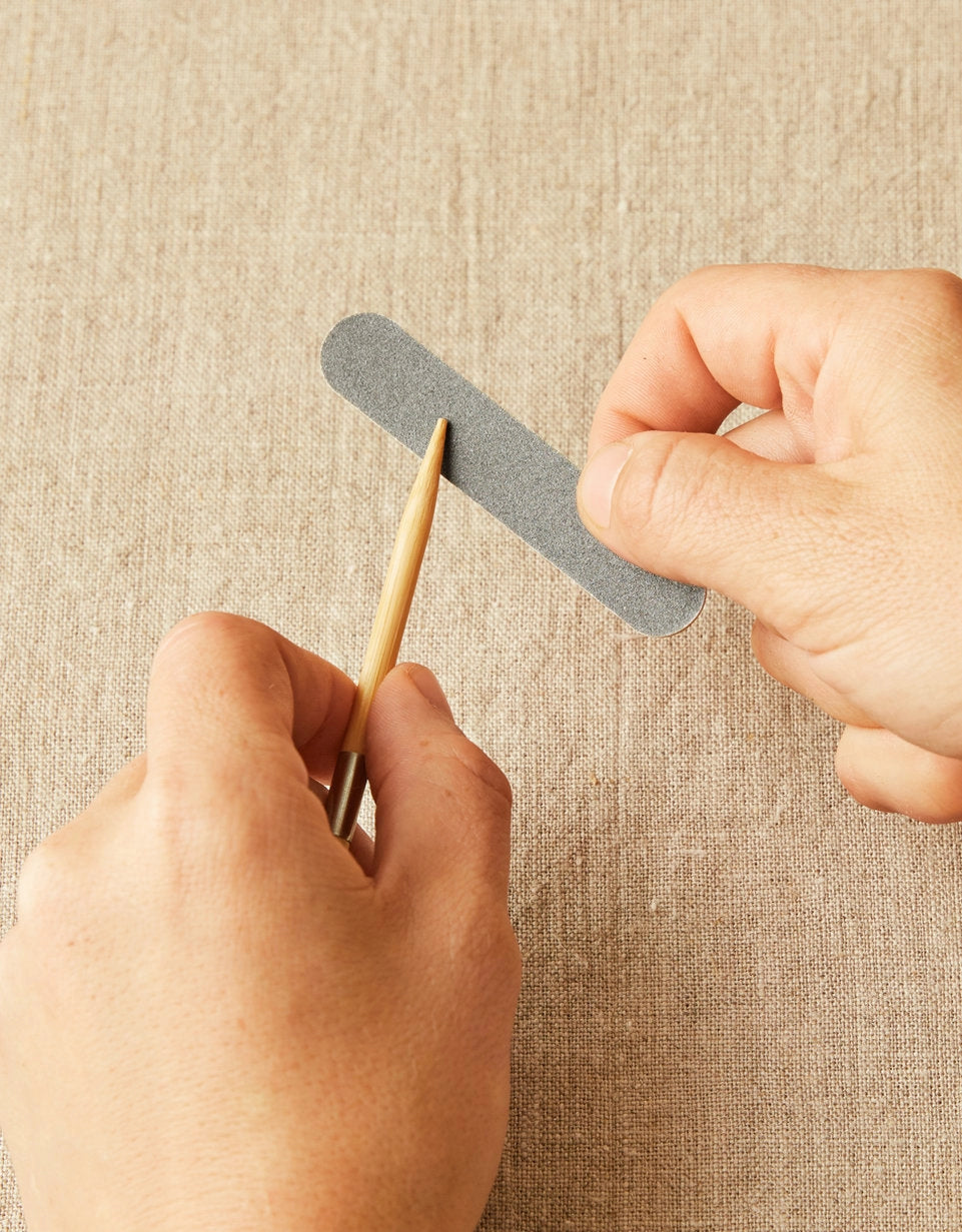 Cocoknits Emery Board being used to smooth a fingernail and prevent yarn snags