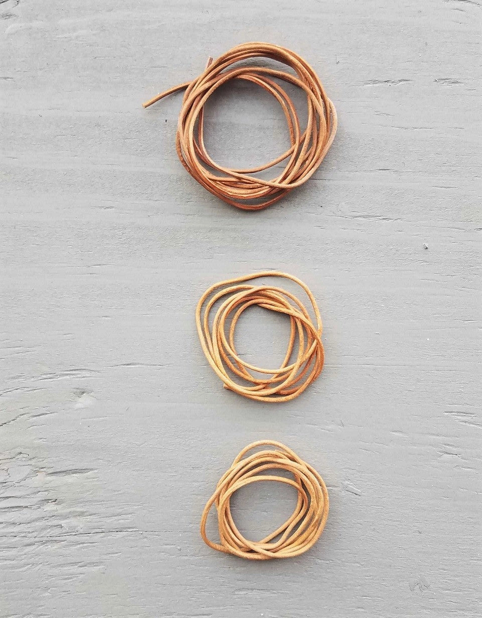 Cocoknits Extra Leather Cords showing one long cord and two shorter cords for holding live stitches