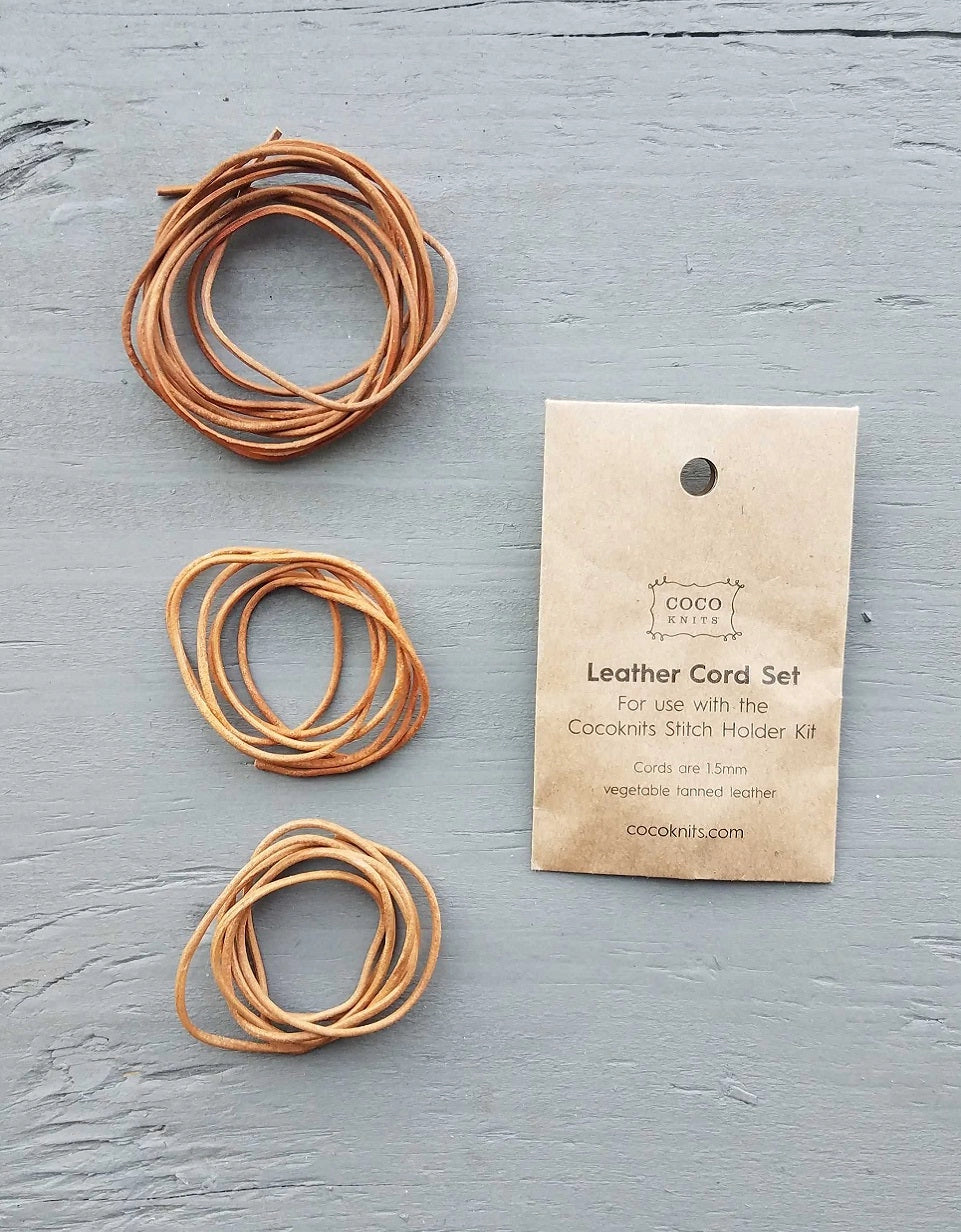 Cocoknits Extra Leather Cords arranged beside their kraft paper packaging