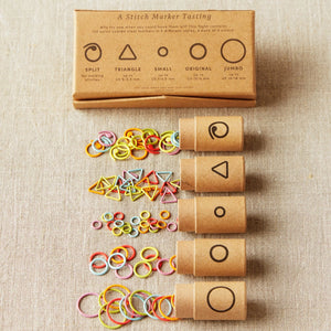 Cocoknits Flight of Stitch Markers sampler with five marker styles in rainbow colors