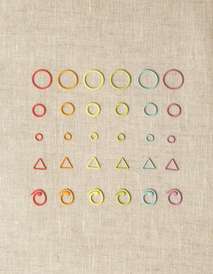 Cocoknits Flight of Stitch Markers showing assorted shapes, sizes, and rainbow colors