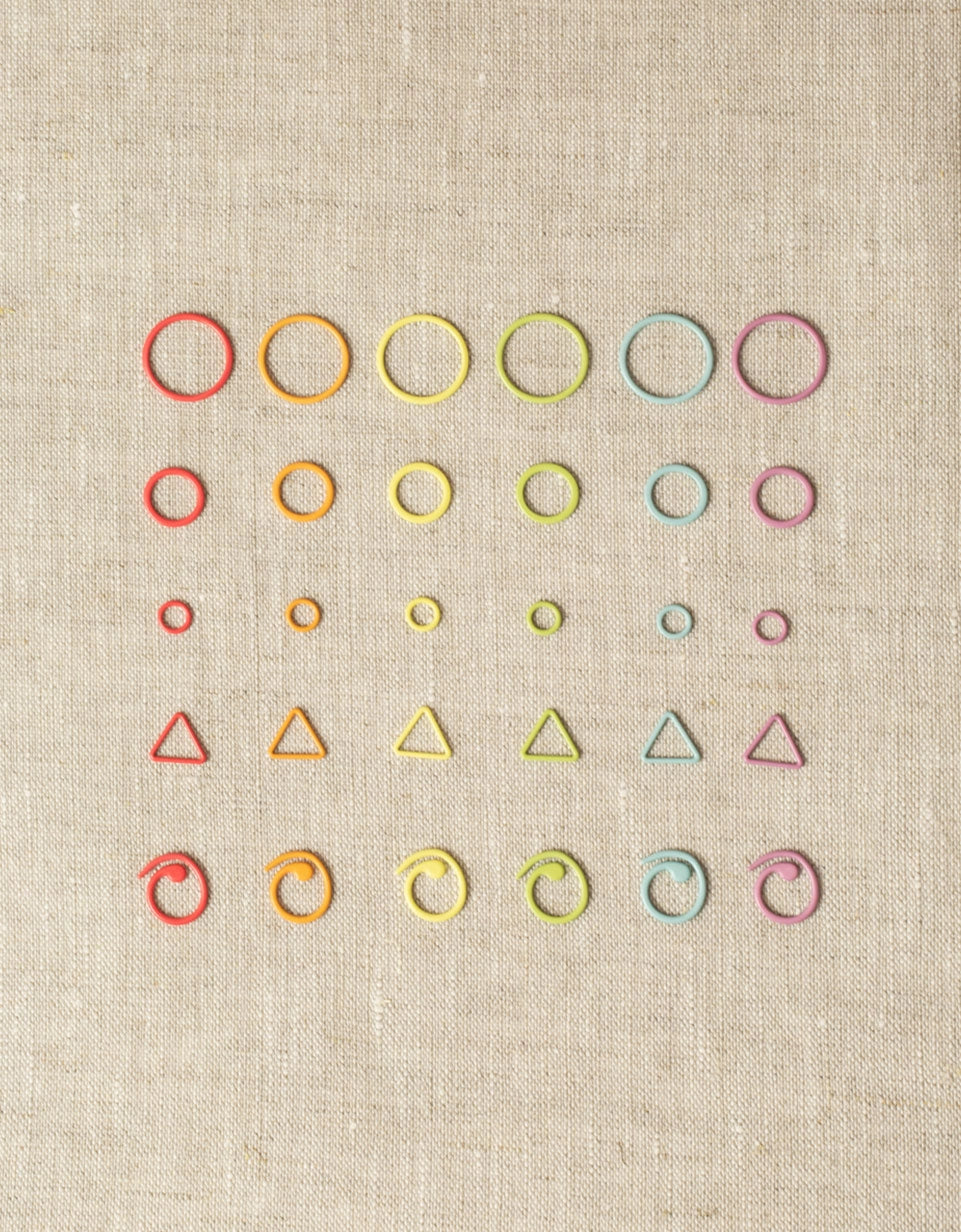 Cocoknits Flight of Stitch Markers showing assorted shapes, sizes, and rainbow colors