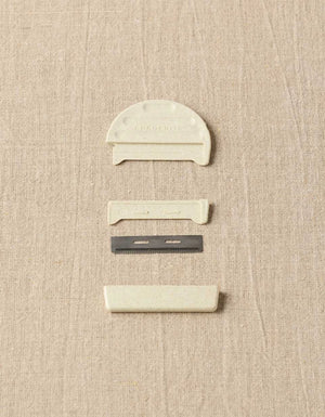 Cocoknits Fuzz Off Comb II components showing protective cover and replaceable steel comb