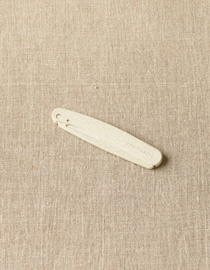 Cocoknits Fuzz Off Comb original folded into its compact position for storage and travel
