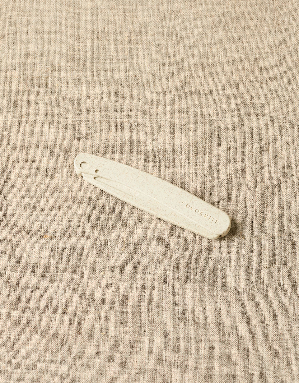 Cocoknits Fuzz Off Comb original folded into its compact position for storage and travel