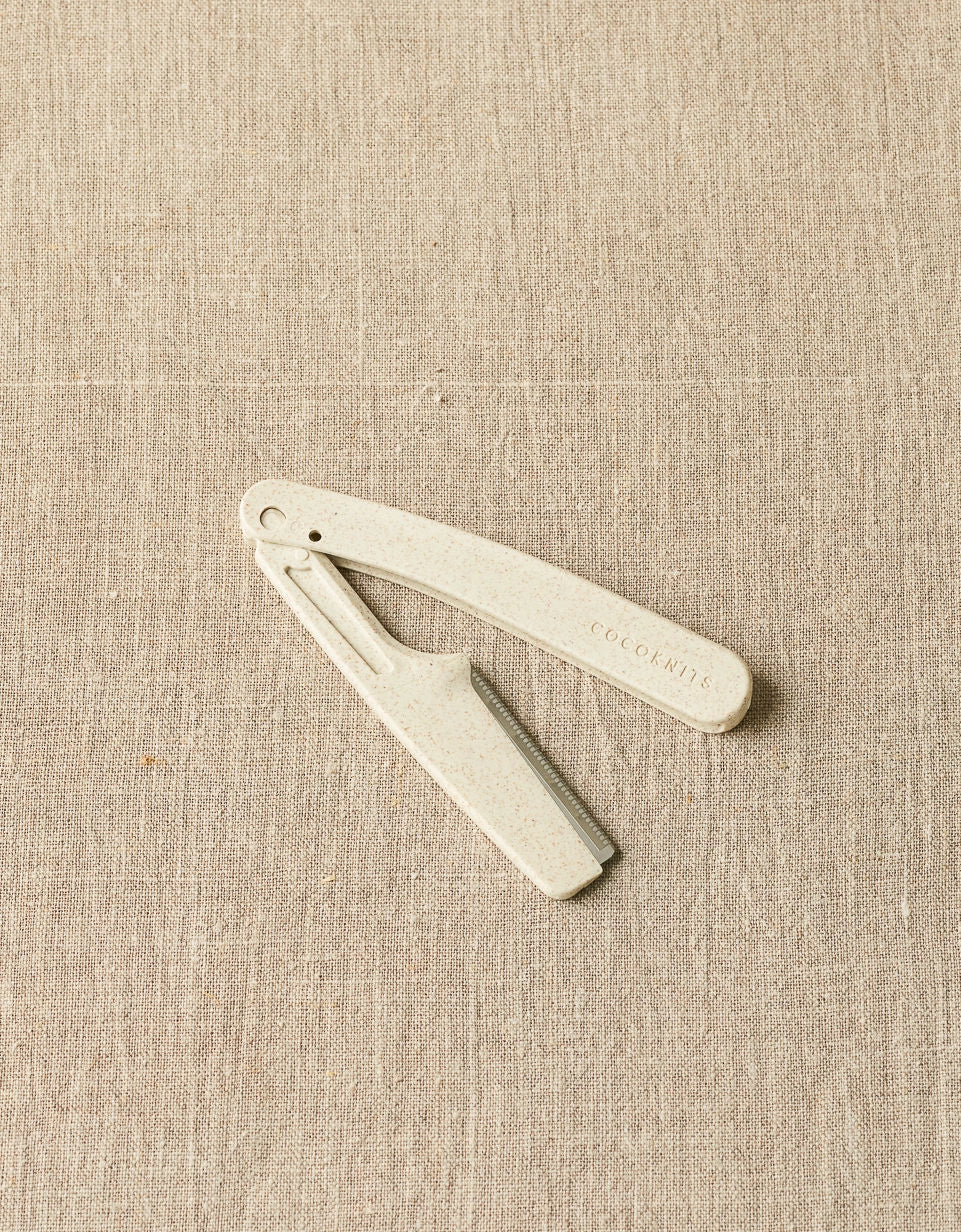 Cocoknits Fuzz Off Comb original shown open with folding handle and steel comb