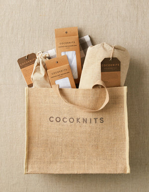 Cocoknits Jute Tote filled with yarn, tools, and knitting supplies