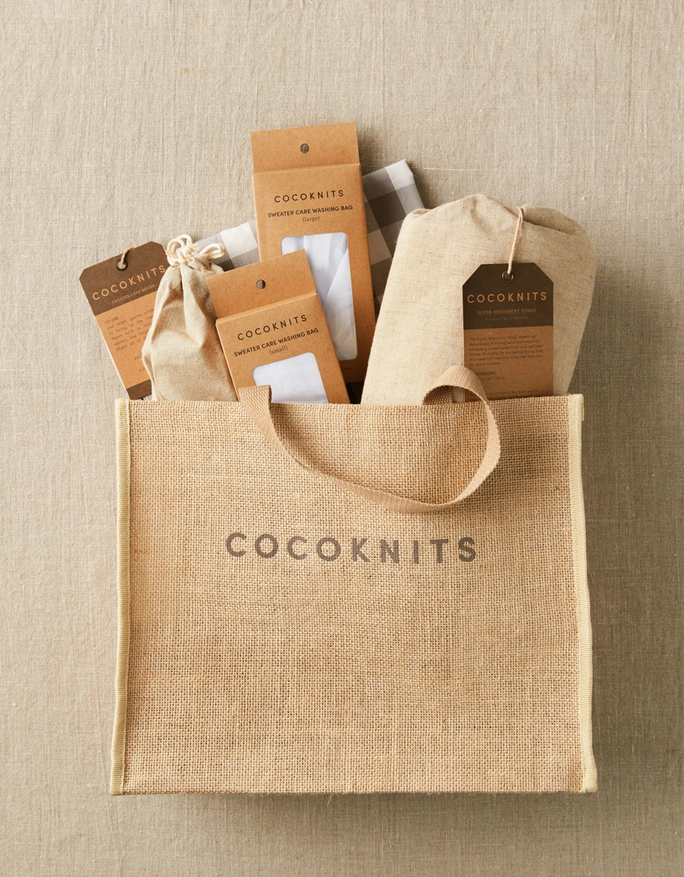 Cocoknits Jute Tote filled with yarn, tools, and knitting supplies