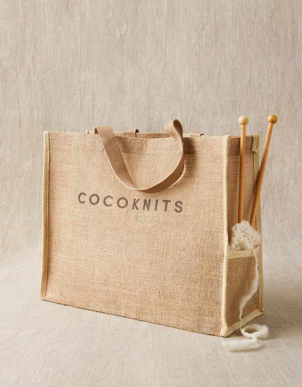 Cocoknits Jute Tote used as a knitting project bag with yarn and knitting needles