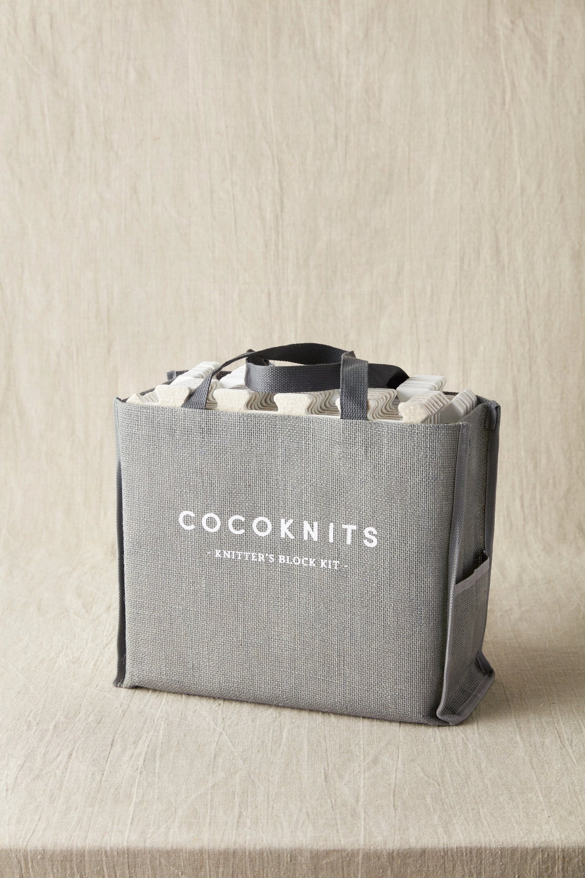 Cocoknits Knitter's Block Kit packed in its jute storage bag