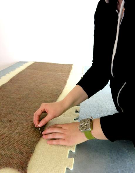 Cocoknits Knitter's Block Kit being used to pin knitted fabric on blocking tiles