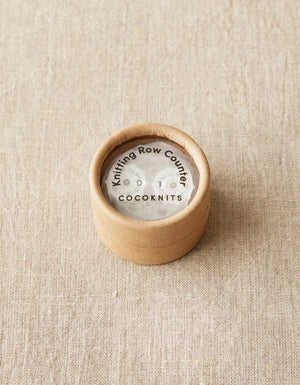 Cocoknits Knitting Row Counter stored in a small round container
