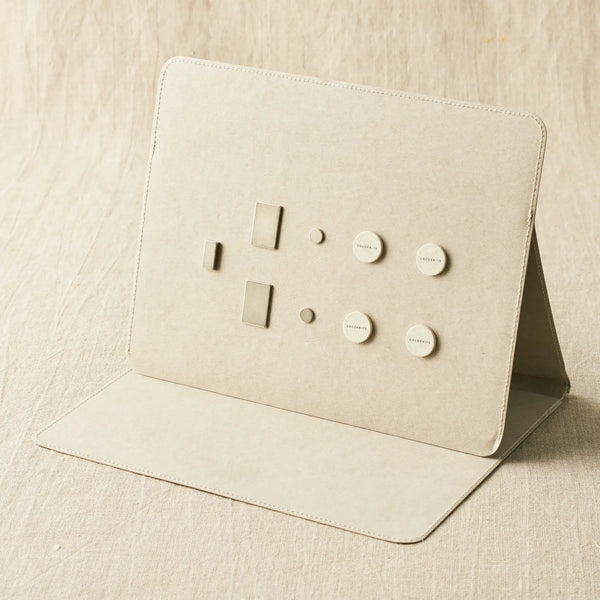 Cocoknits Maker's Board in Gray standing open with included magnets and magnetic tools