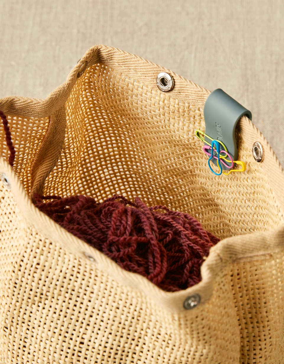 Cocoknits Maker's Clip in Gray attached to a knitting project bag
