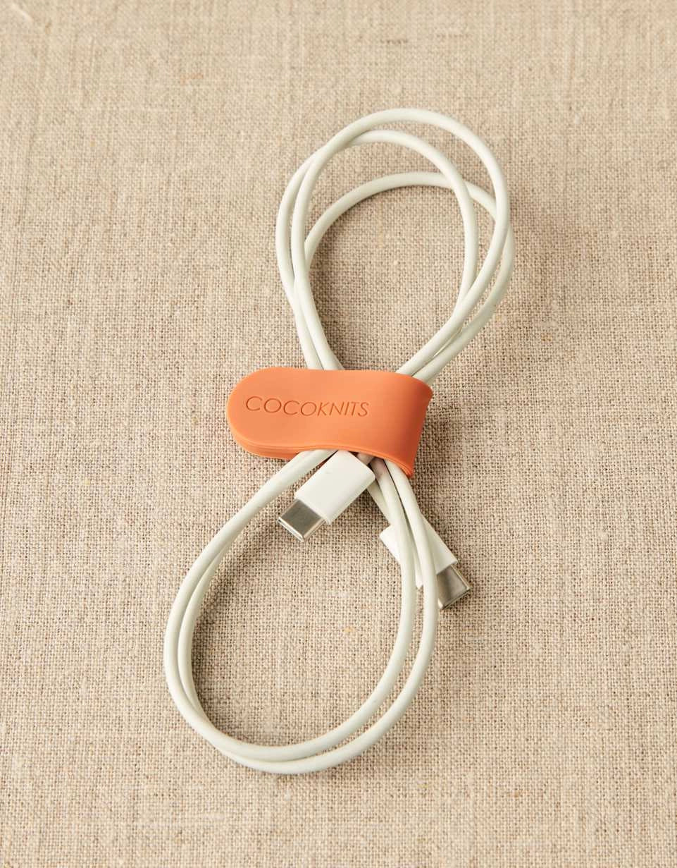 Cocoknits Maker's Clip in Orange organizing a coiled cord