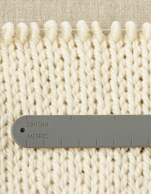 Cocoknits Maker's Keep magnetic wristband shown with knitted fabric