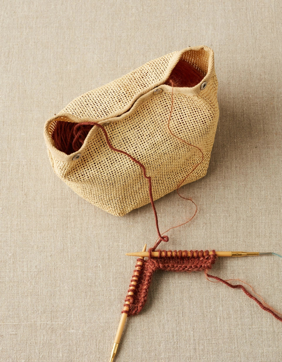 Cocoknits Natural Mesh Bag holding yarn for a red knitting project