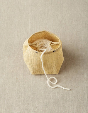 Cocoknits Natural Mesh Bag holding a ball of yarn