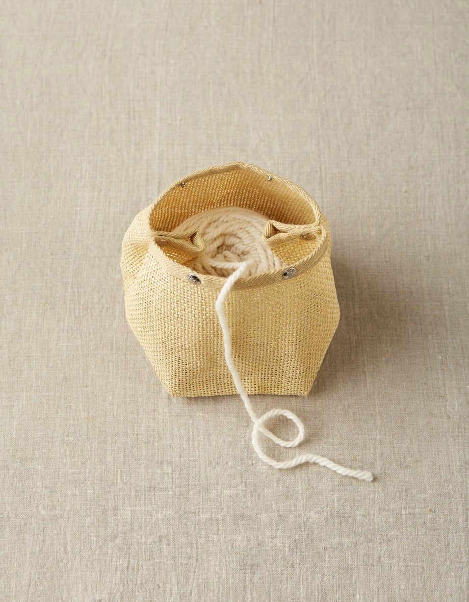 Cocoknits Natural Mesh Bag holding a ball of yarn