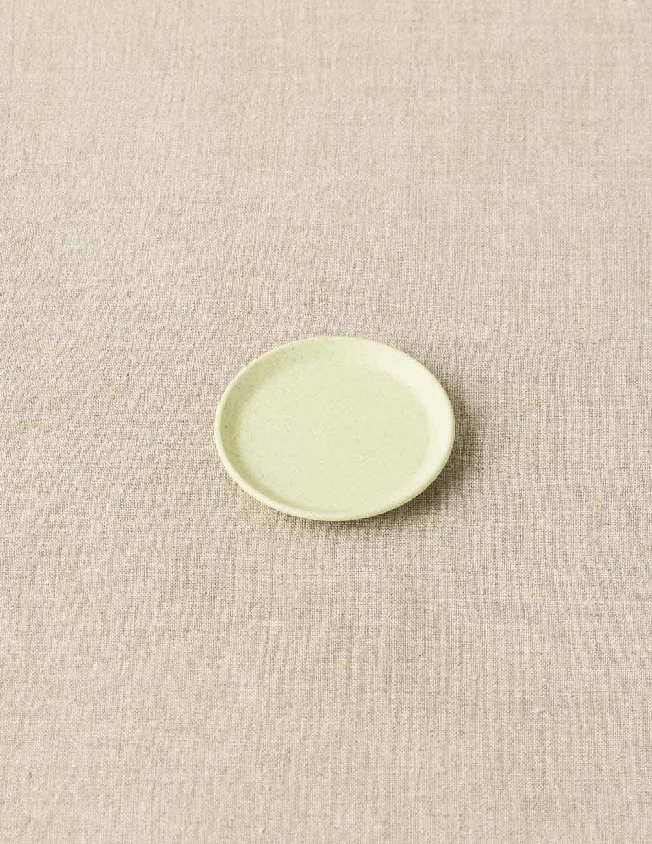 Cocoknits Notions Dish in Celery on a beige linen background