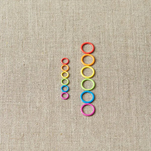 Cocoknits Small Round Stitch Markers arranged by rainbow color for a clear view of the ring design