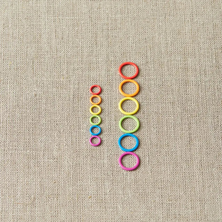 Cocoknits Small Round Stitch Markers arranged by rainbow color for a clear view of the ring design