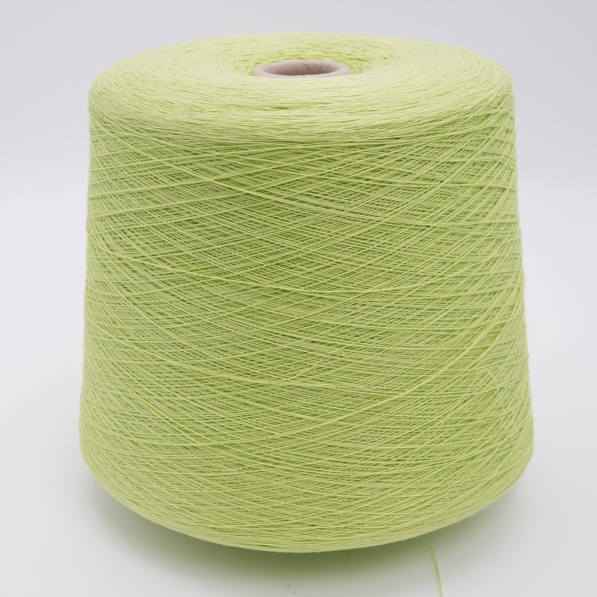 Cone of Cottone 100% cotton yarn in lime green.