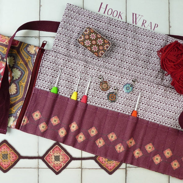 Crochet Hook Wrap - Janie Crow. Crochet hook wrap opened to show crochet hooks and patterned pockets.