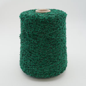 Cone of Curly bouclé cotton and polyamide blend yarn in Green on Black.
