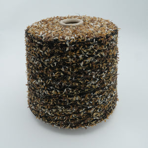 Cone of Fantasia Decor eyelash 100% polyamide yarn in black and gold.