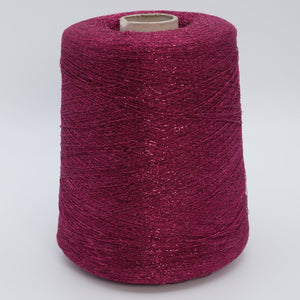 Cone of Frizzante 35000 viscose blend yarn in Berry Stardust.