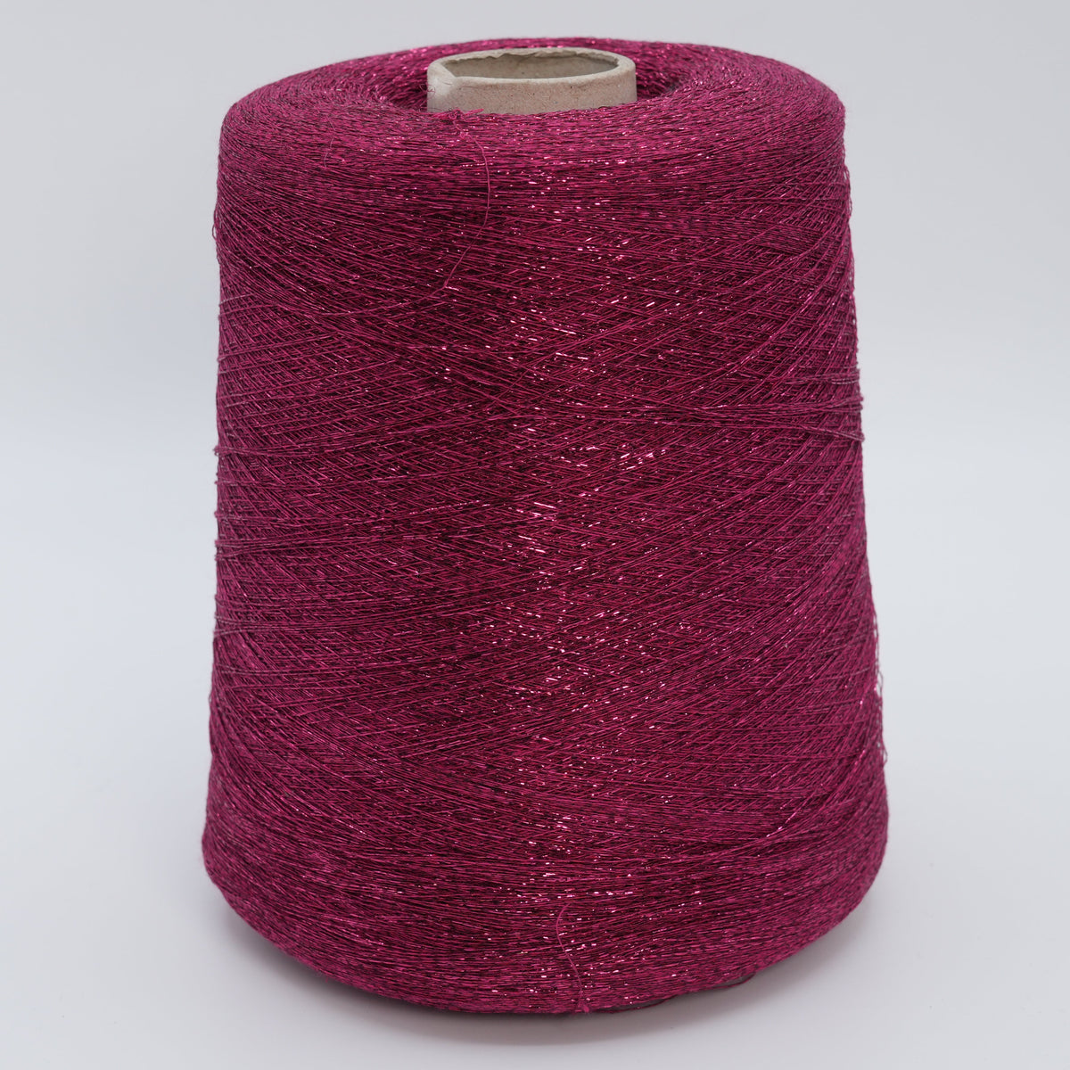Cone of Frizzante 35000 viscose blend yarn in Berry Stardust.