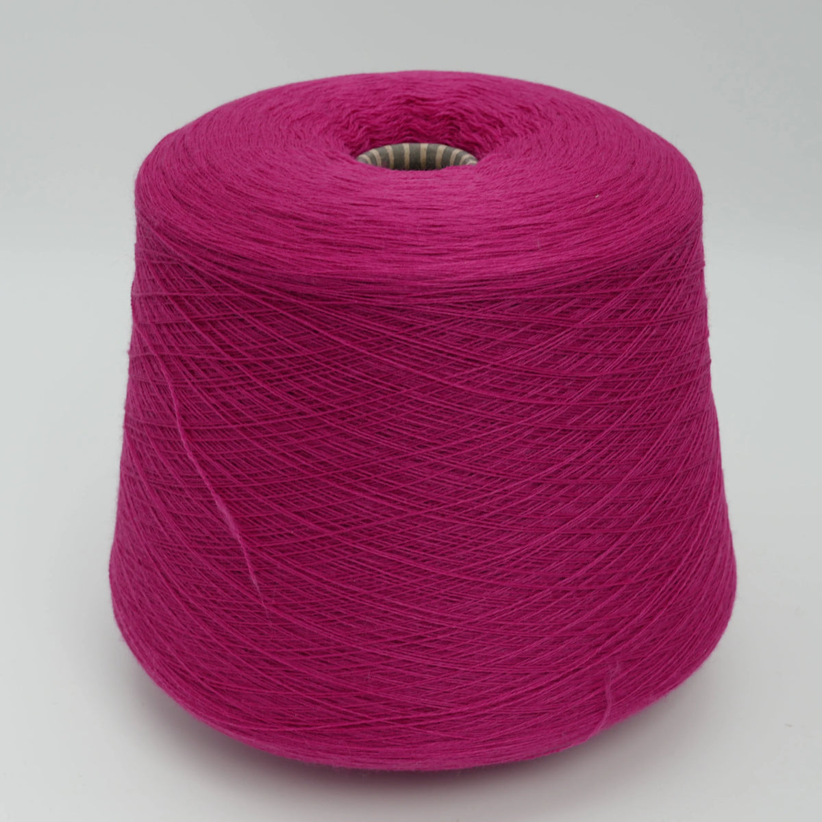 Cone of Harmony 2/30 100% merino yarn in fuchsia.