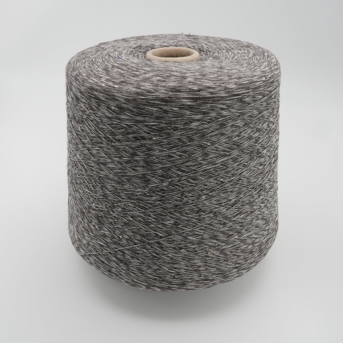Cone of Linette cotton and linen blend yarn in Hematite Melange.