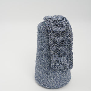 Cone and knitted swatch of Linette cotton and linen blend yarn in Sapphire Melange.